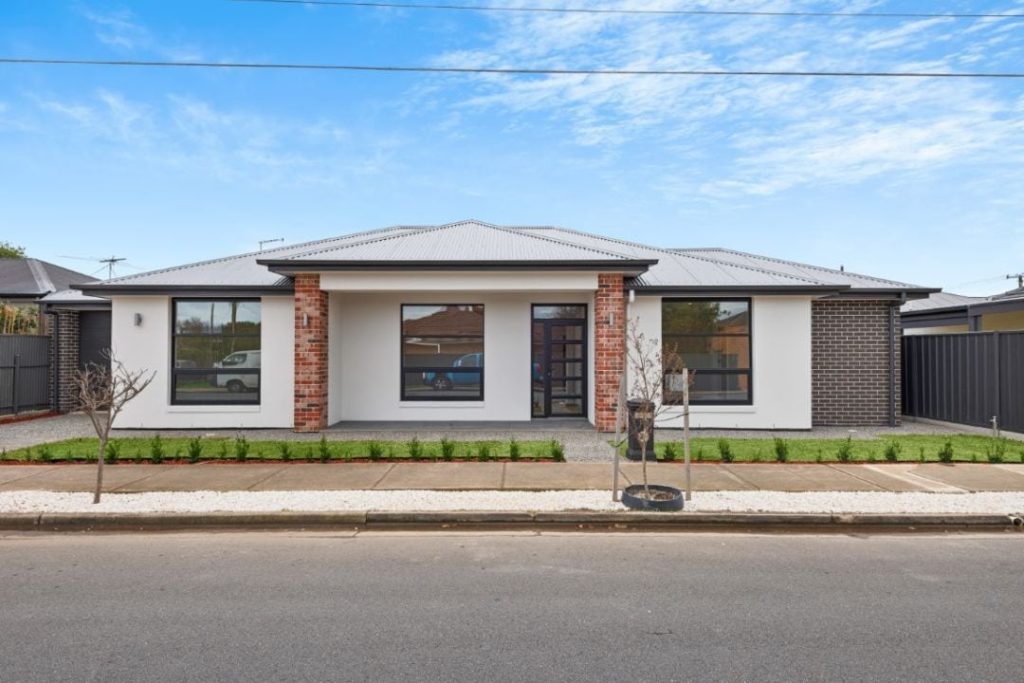 Modern Open Living Area by Claridge Construction